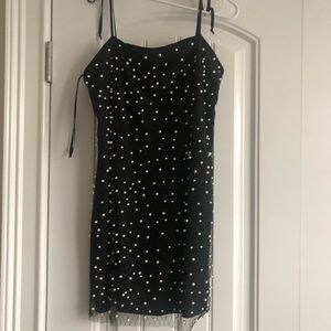 forever 21 mini black dress, loose fitting with pearls attached to it.
